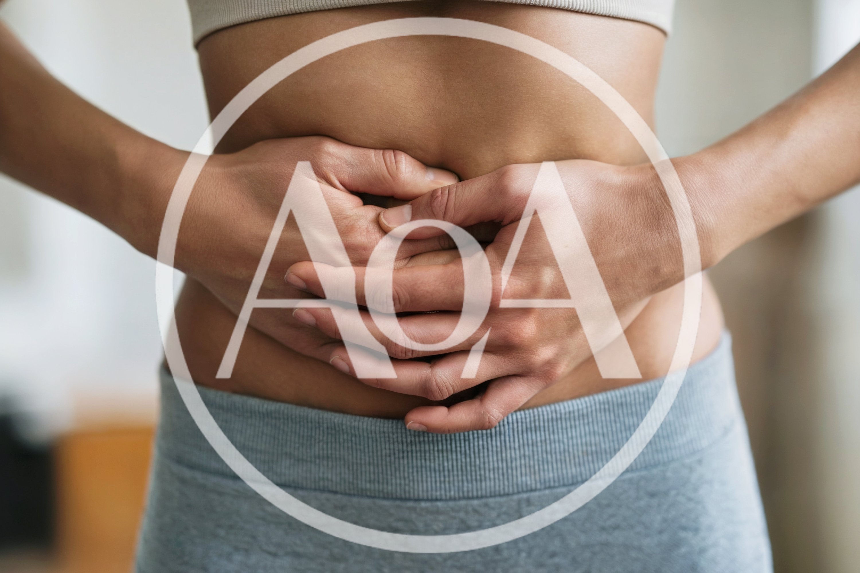 Woman Holding Her Stomach Due To Abdominal Pain