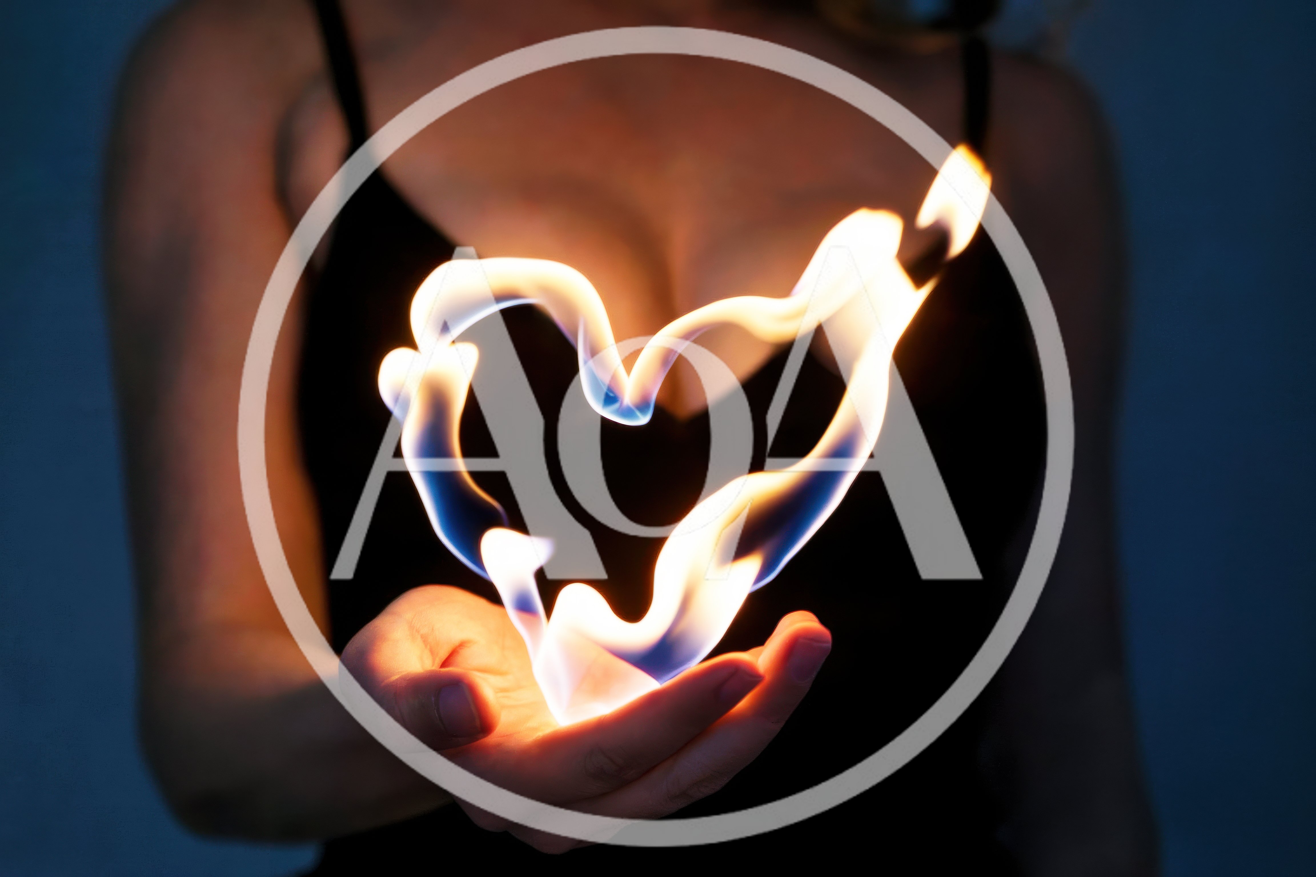 Woman Holding A Glowing Heart Shaped Flame