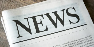 Close Up Of A Newspaper With News Headline