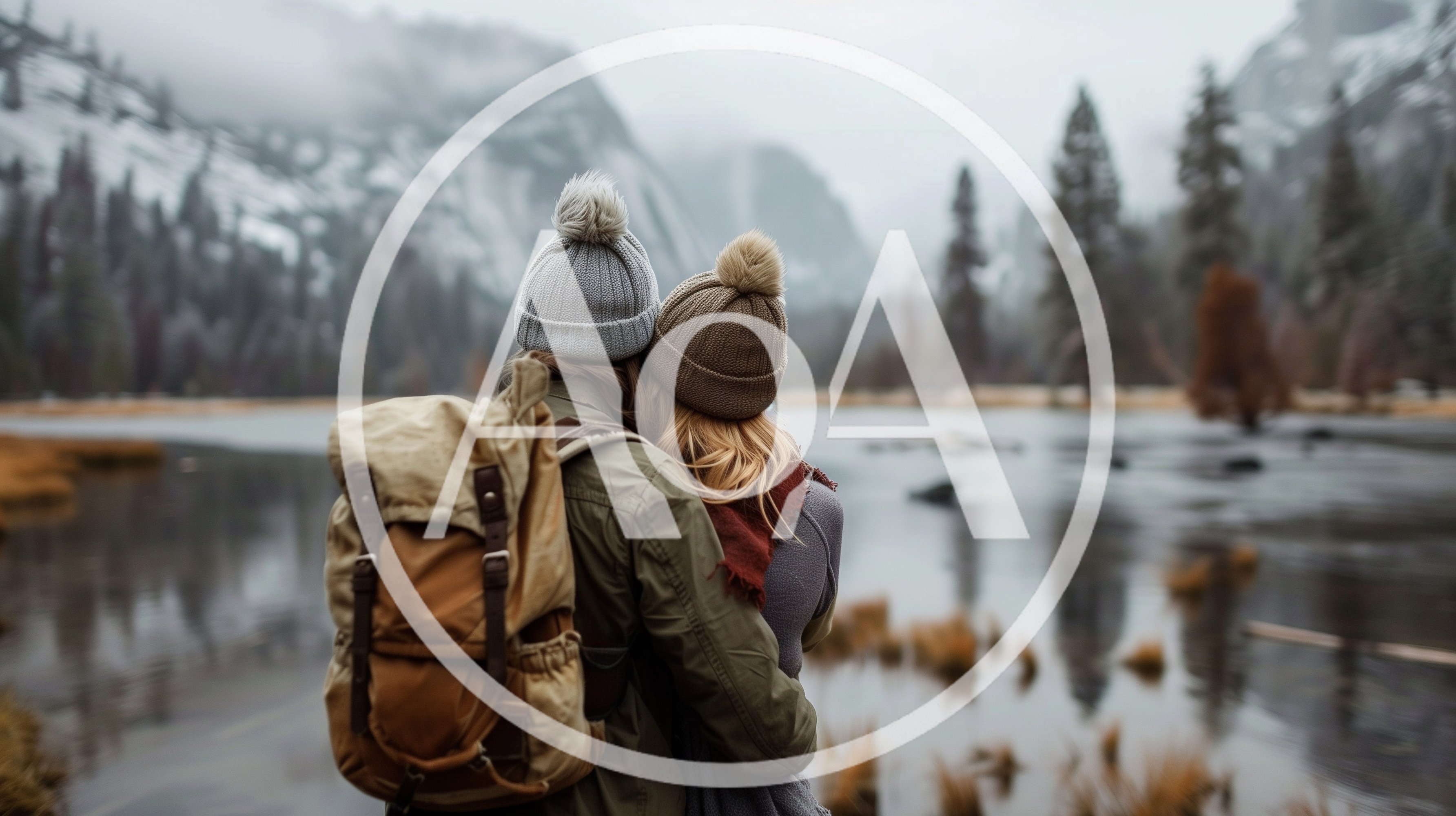 Couple Embracing While Looking At A Mountain Lake