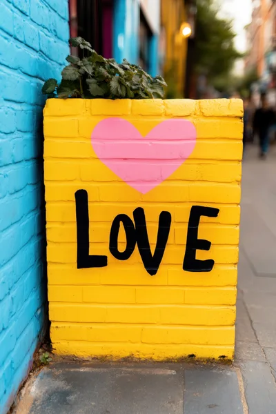 Yellow Brick Planter With Love Signage