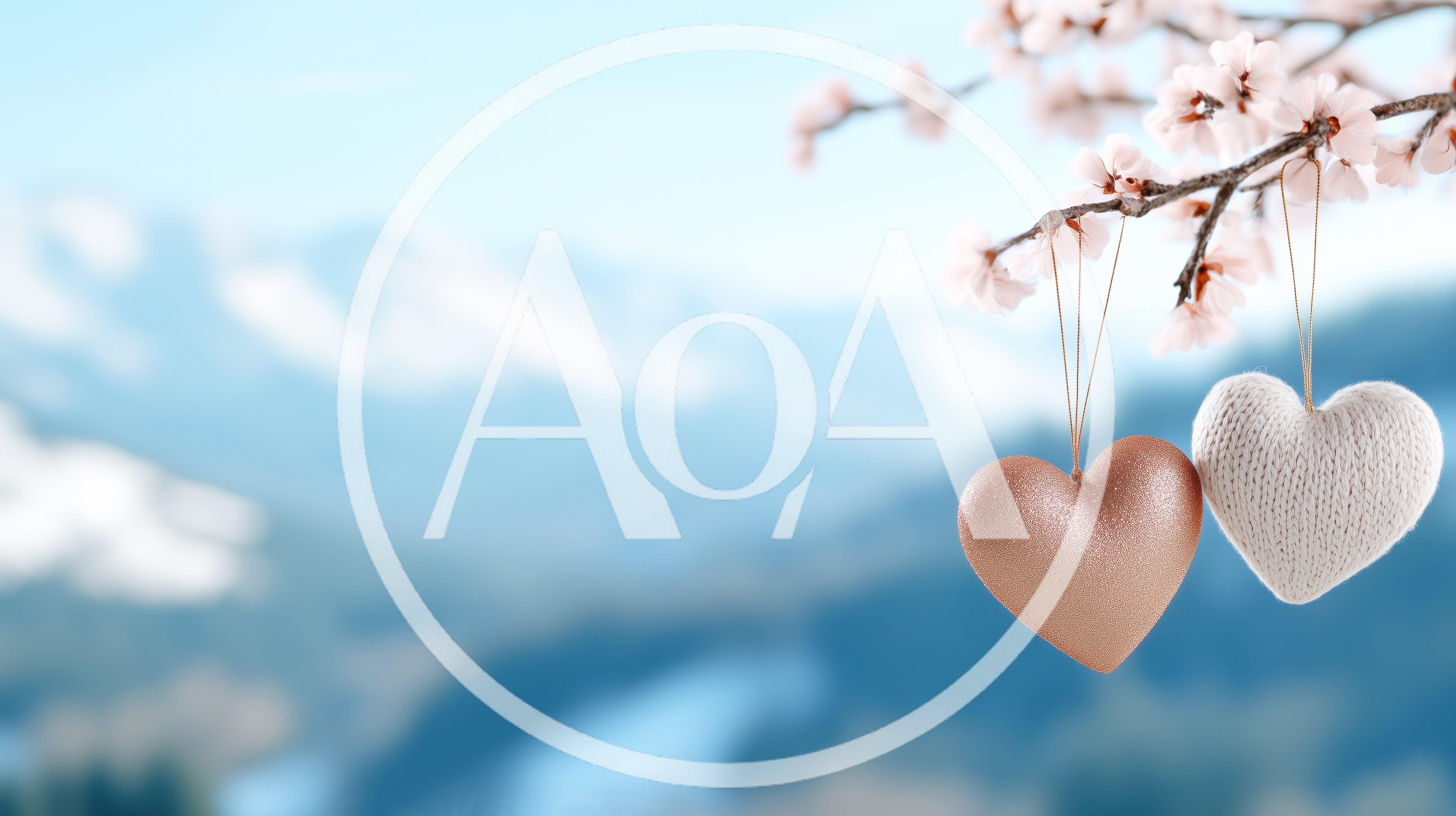 Two Decorative Hearts Hanging From A Flowering Branch