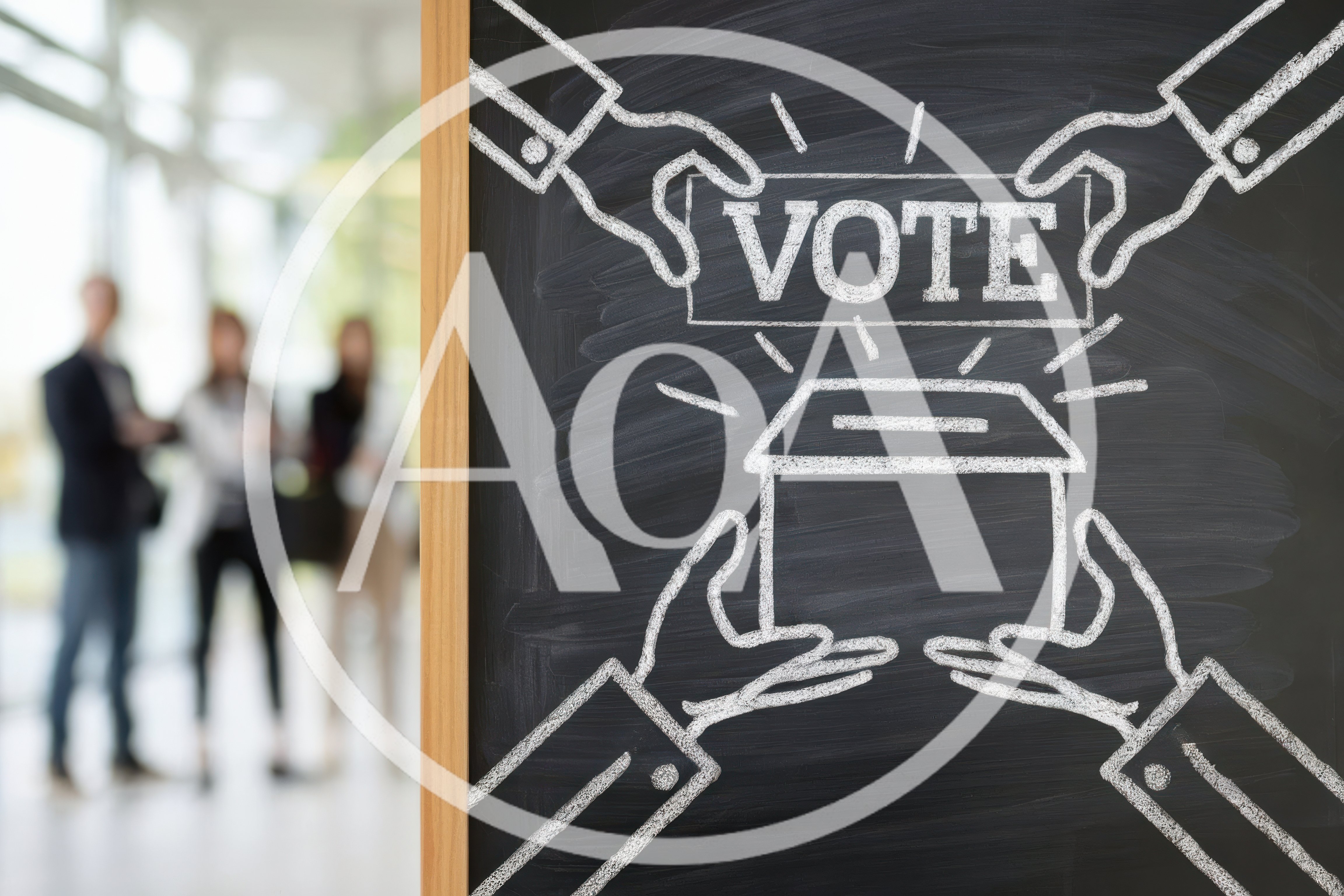 Chalkboard Drawing of Hands Holding a Vote Ballot Box