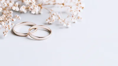 Two Gold Wedding Rings With Baby Breath Flowers