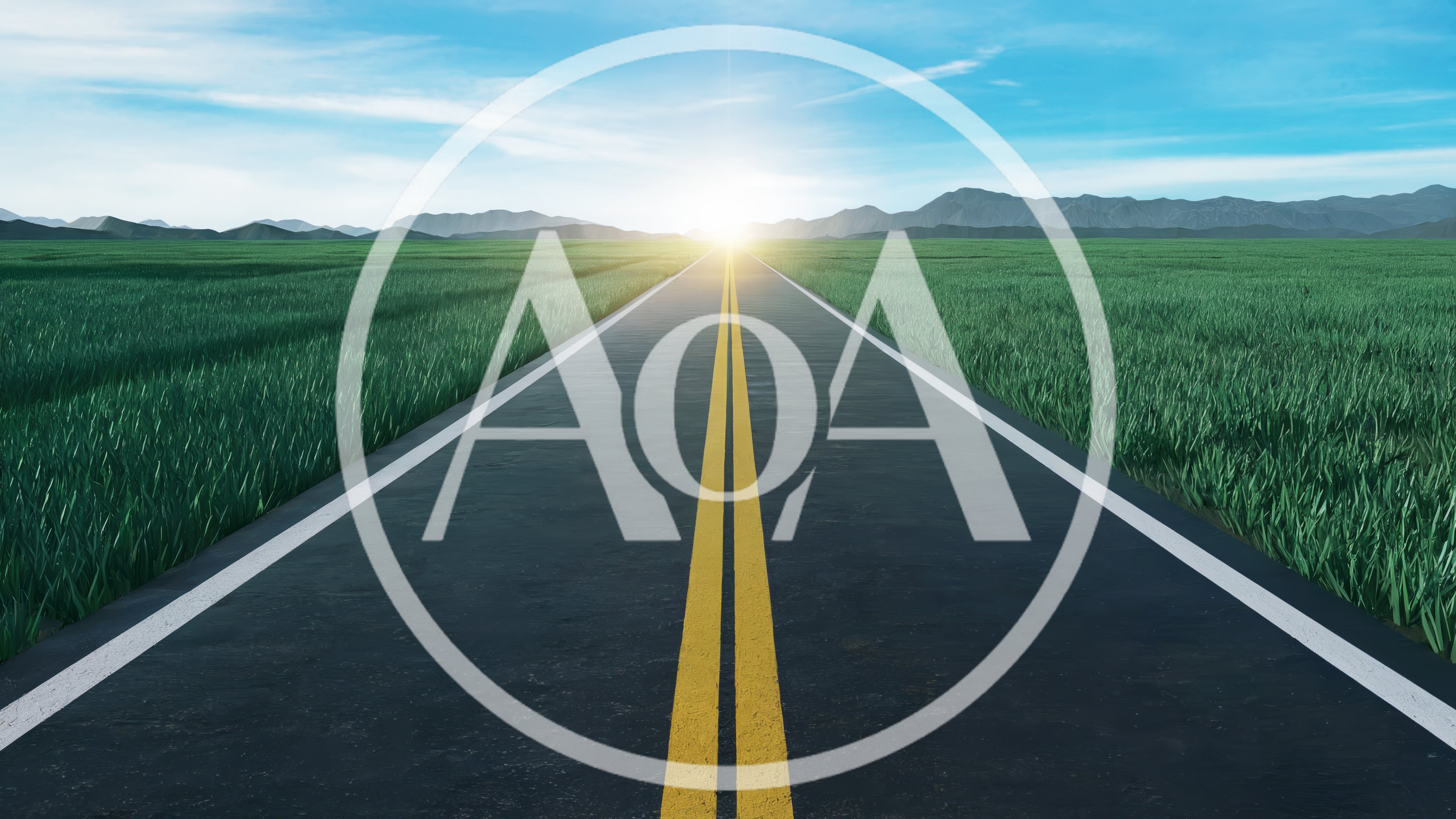 Empty Asphalt Road Through Green Grass Field At Sunrise