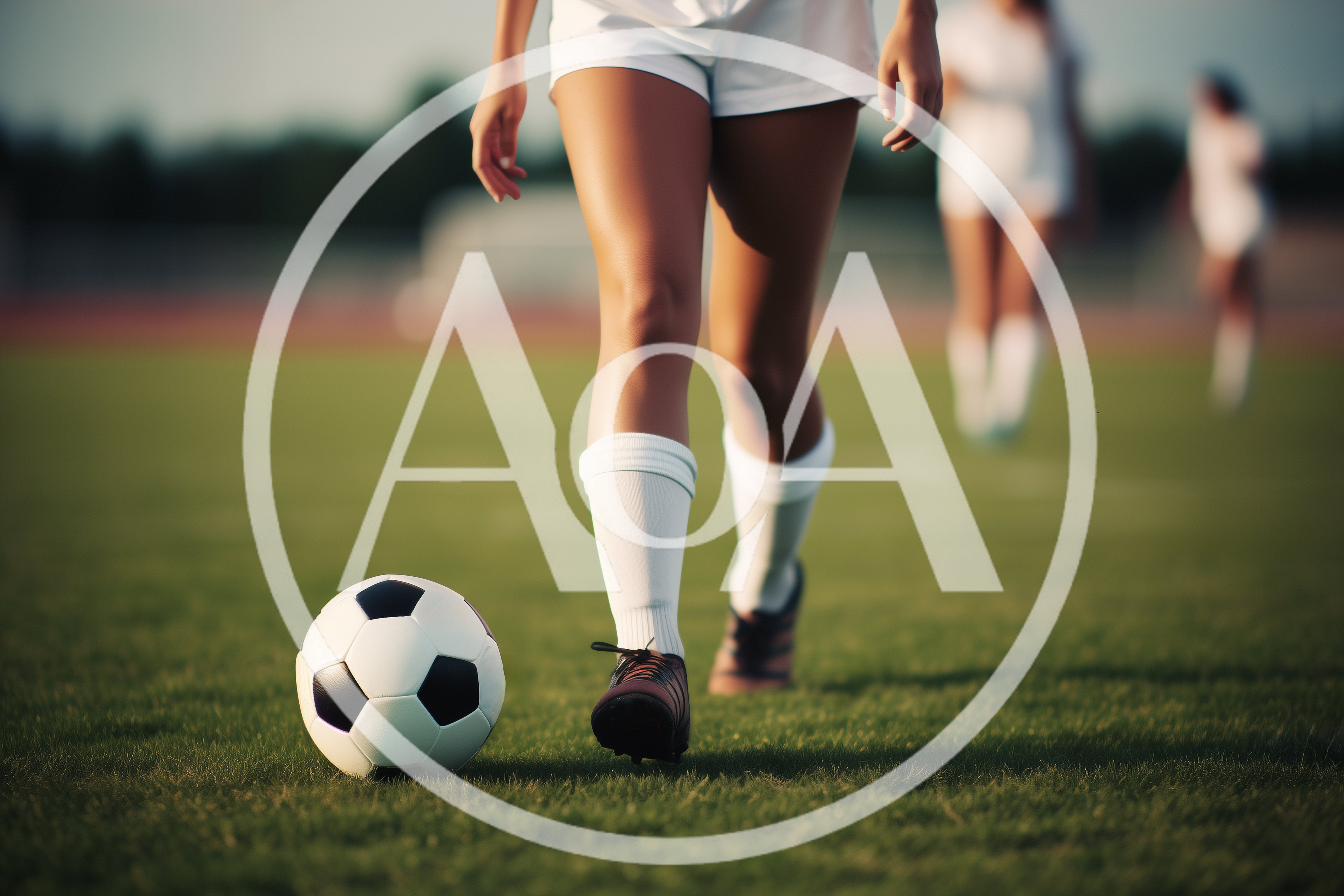 Female Soccer Player Dribbling Ball On Field
