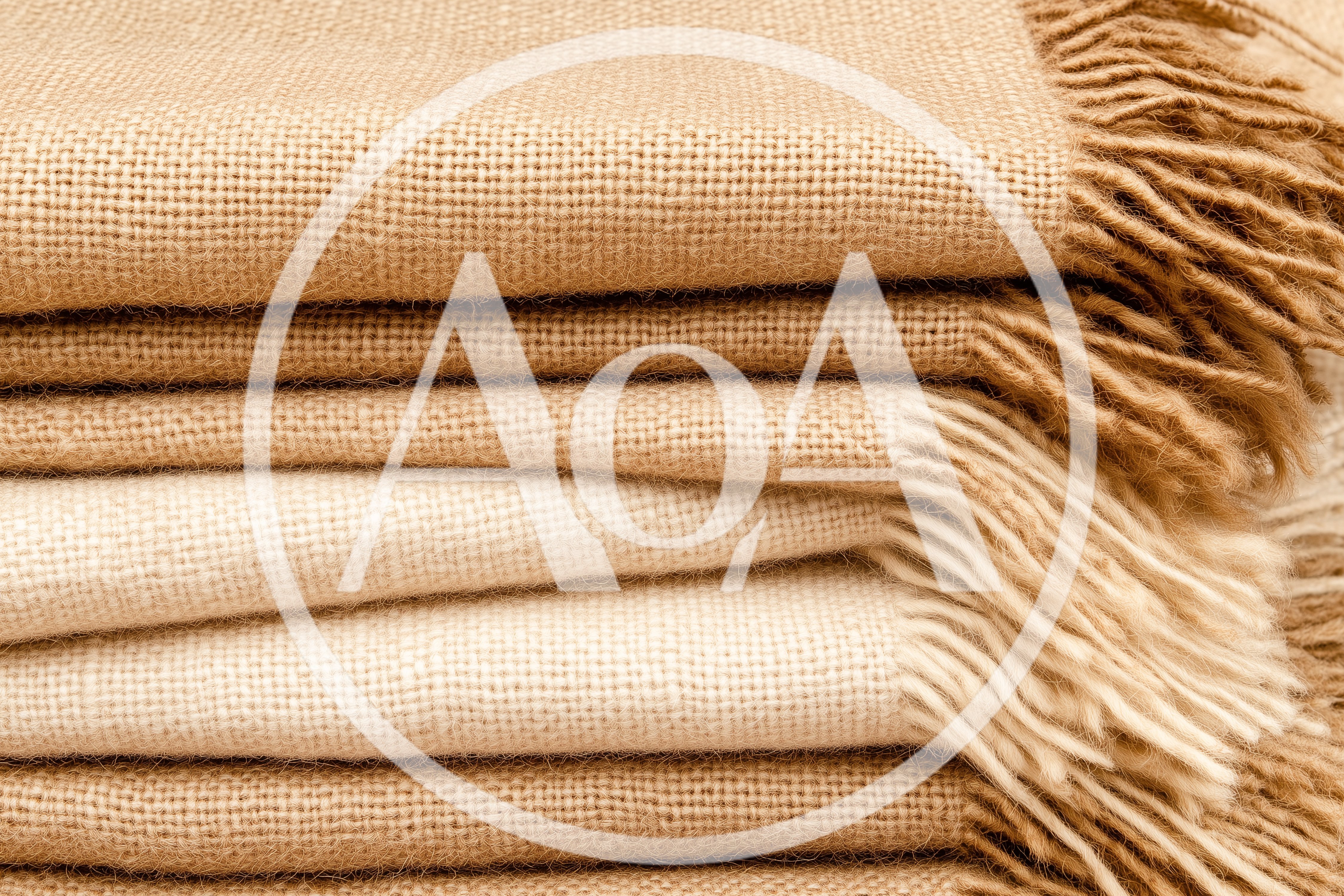 Stack Of Folded Textured Burlap Fabric Blankets
