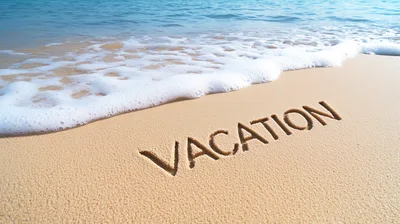 Vacation Word Written In The Sand On A Beach