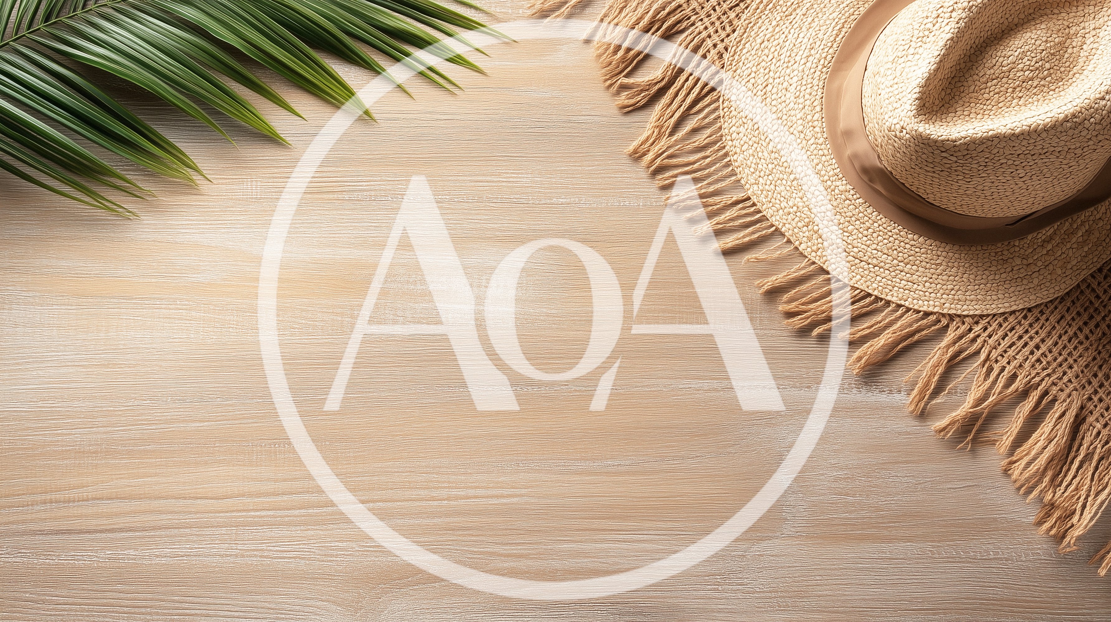 Straw Hat and Palm Leaf on Wooden Background