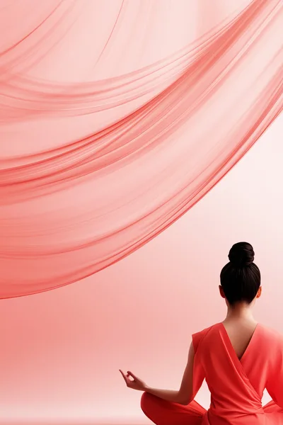 Woman Practicing Yoga In Minimalist Coral Studio