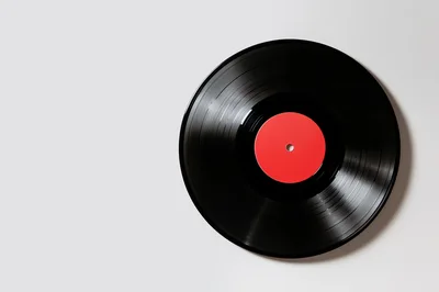 Black Vinyl Record With Red Center Label