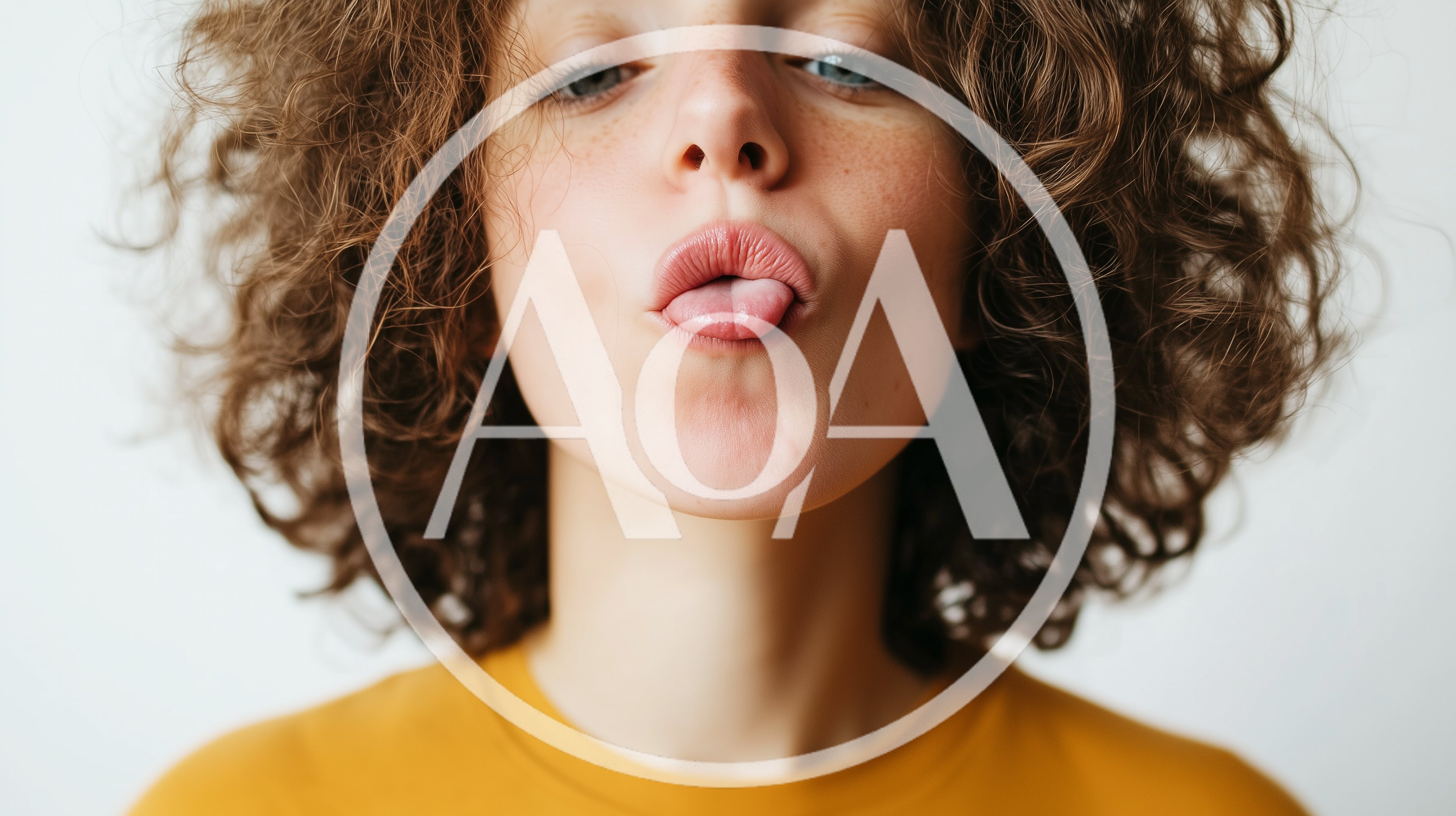 Young Woman With Curly Hair Making A Funny Face