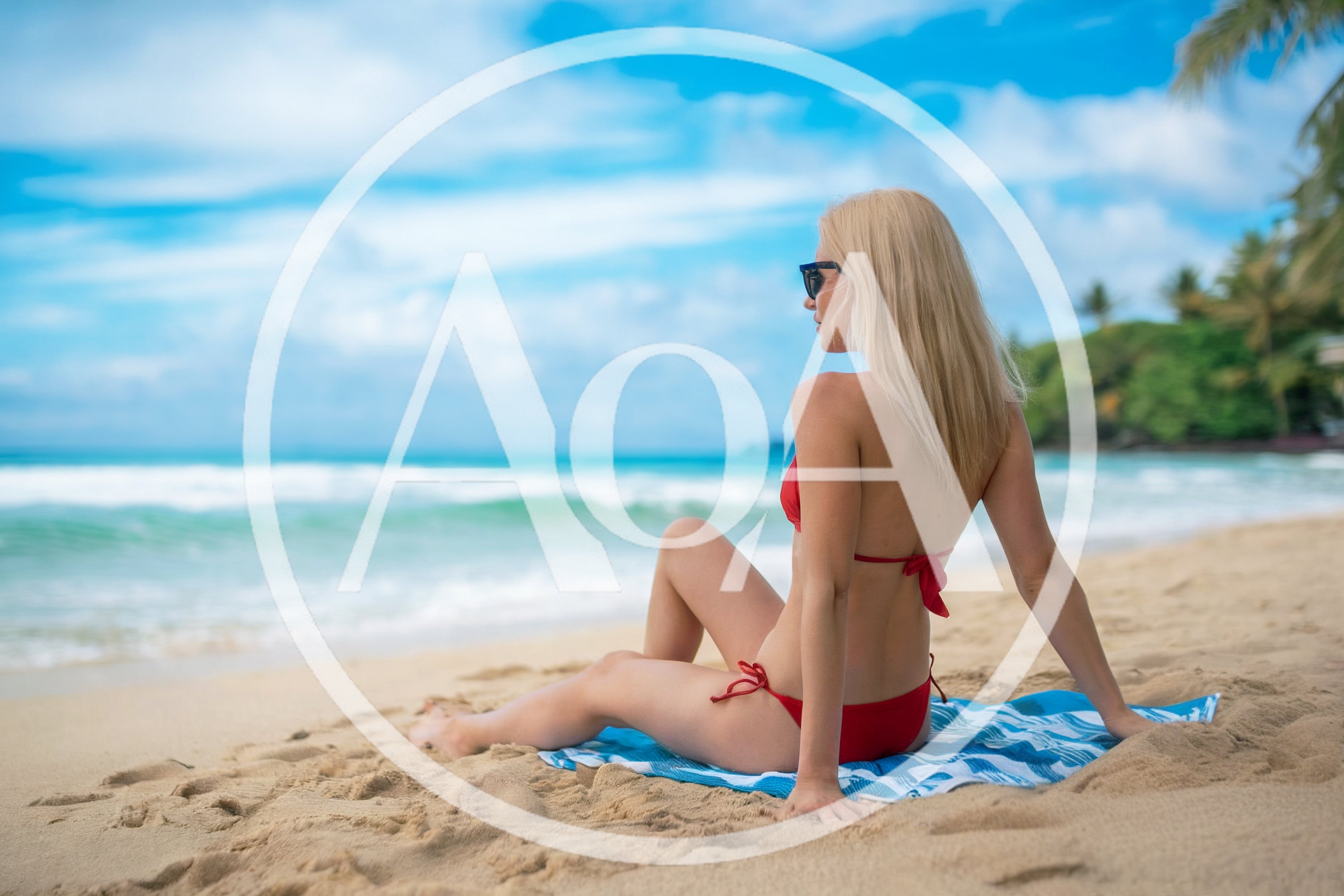 Blonde Woman Relaxing On Tropical Beach In Red Bikini