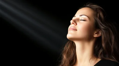 Serene Woman With Closed Eyes In Spotlight