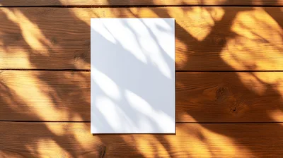 Blank White Paper Sheet on Wooden Table