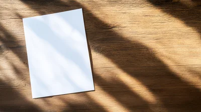 Blank White Paper Sheet on Rustic Wooden Table