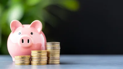 Pink Piggy Bank With Stacks Of Gold Coins