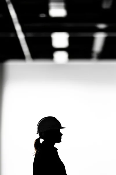 Silhouette Of A Female Construction Worker In Hard Hat