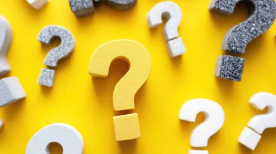 Assorted Question Mark Symbols on Yellow Background