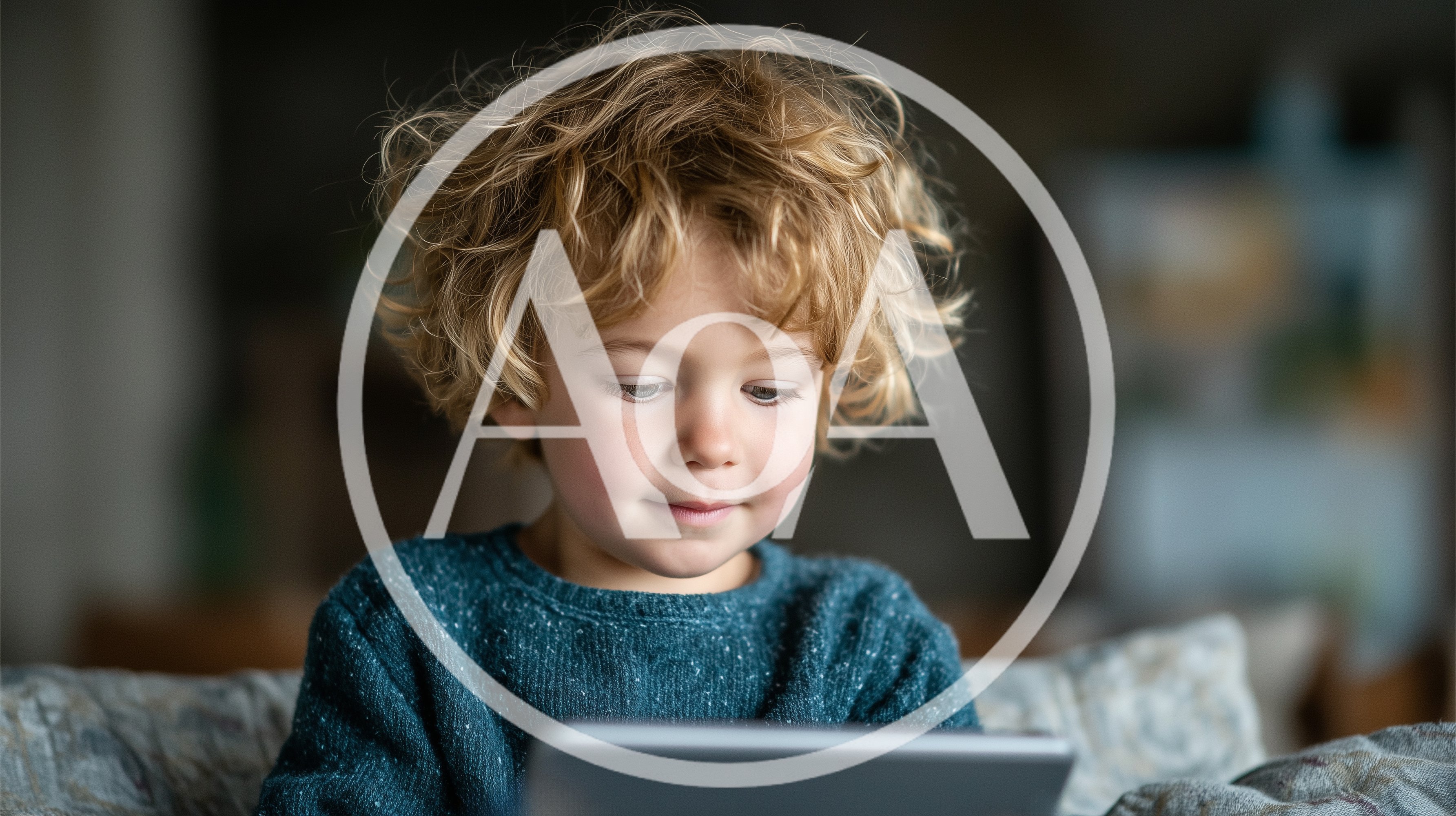 Young Boy With Curly Hair Using A Tablet