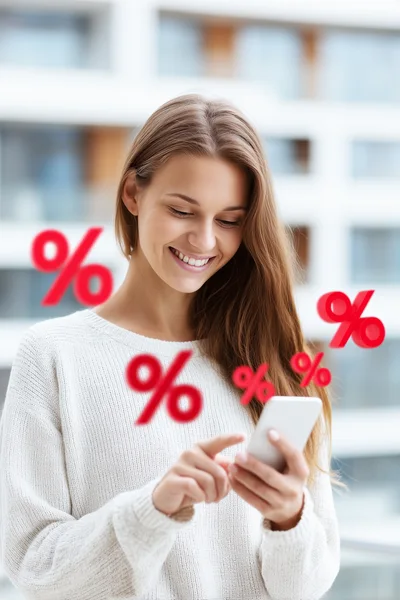 Young Woman Using Smartphone With Floating Percentage Symbols