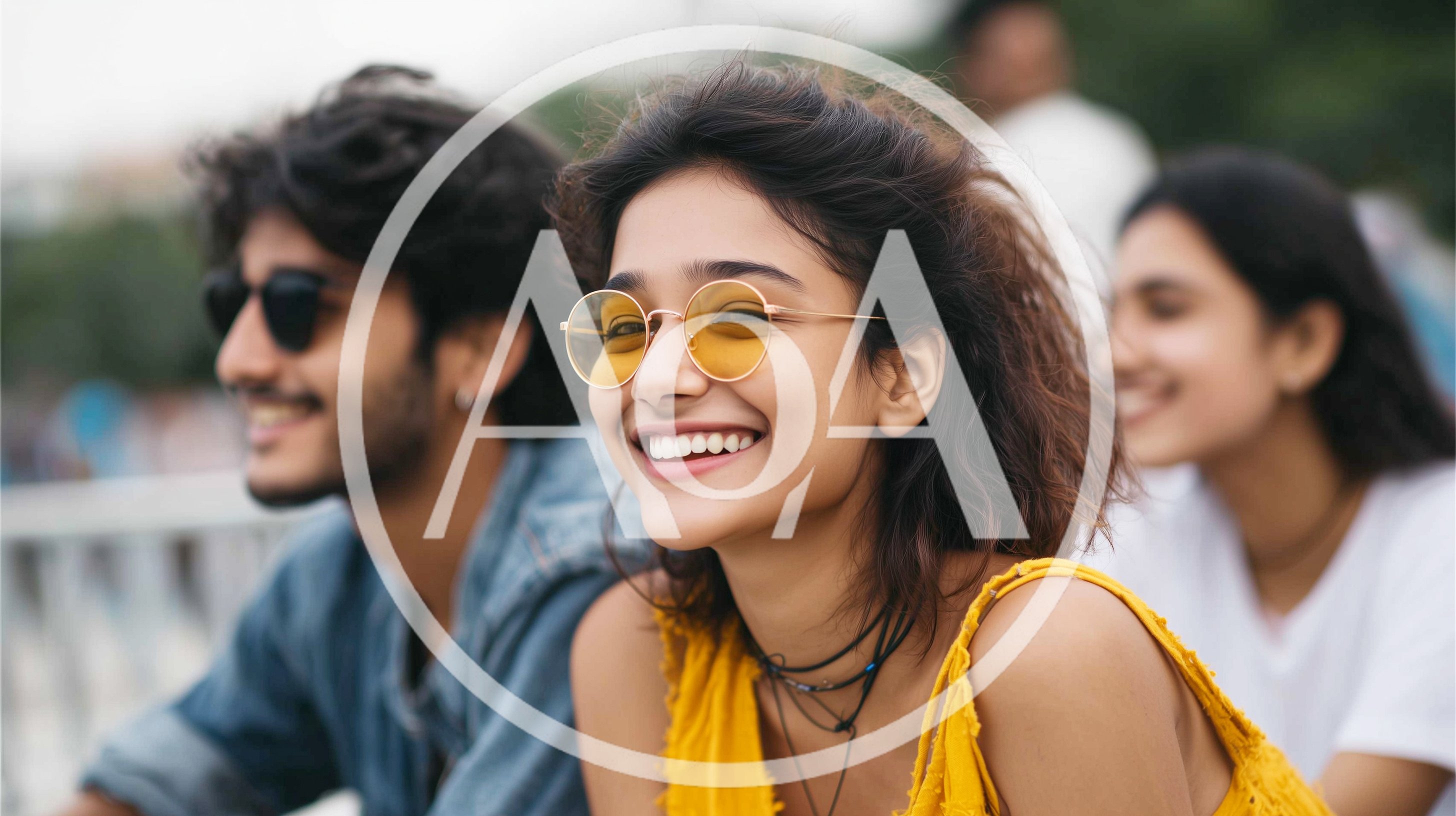 Young Friends Smiling Outdoors During A Sunny Day