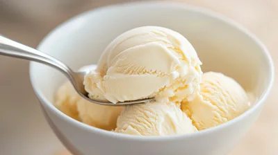 Scoop Of Vanilla Ice Cream In A White Bowl