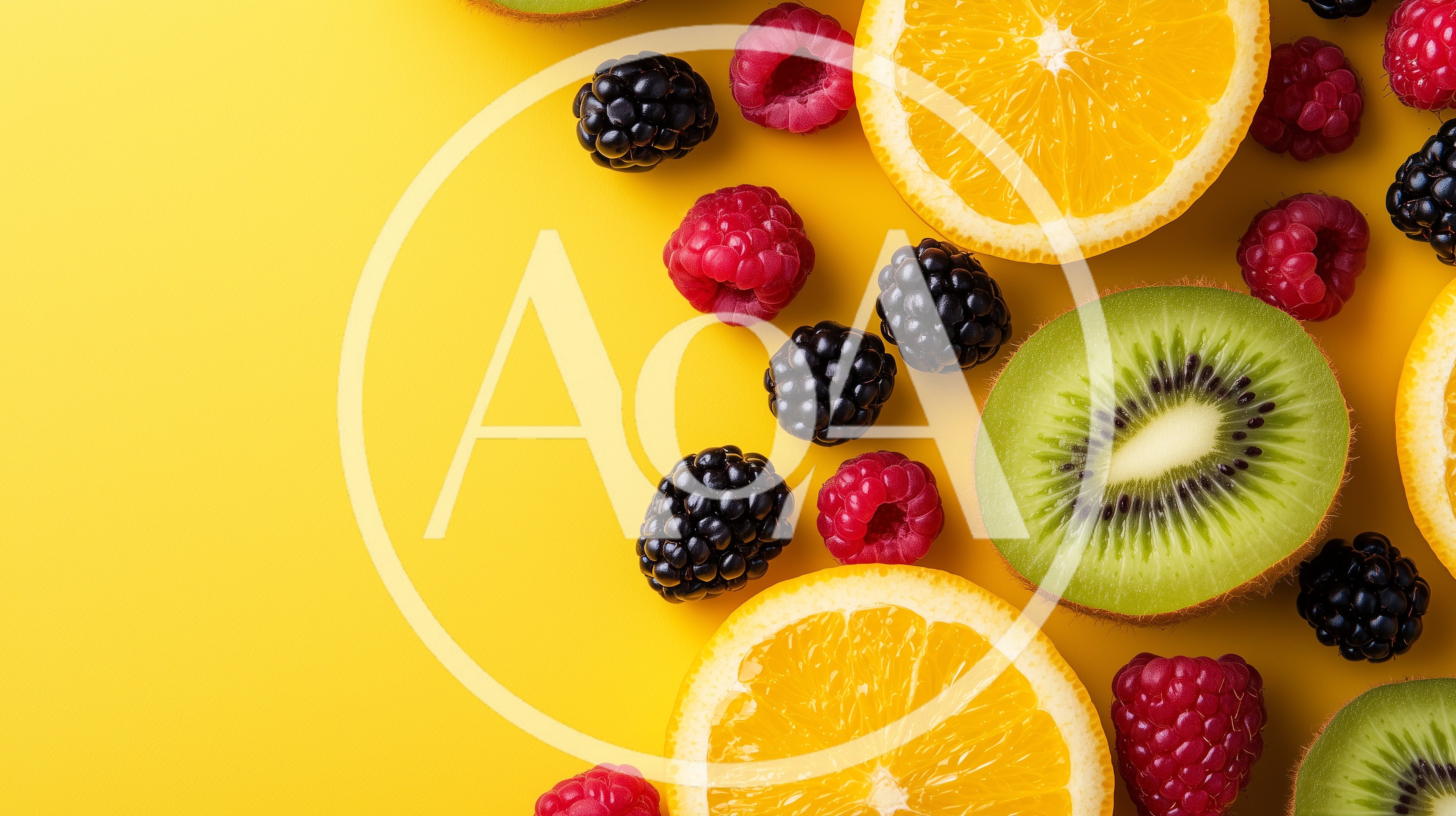 Fresh Assorted Fruit Slices and Berries on Yellow Background