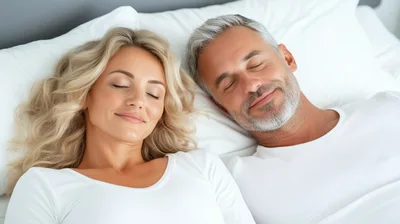 Middle Aged Couple Sleeping Peacefully In Bed