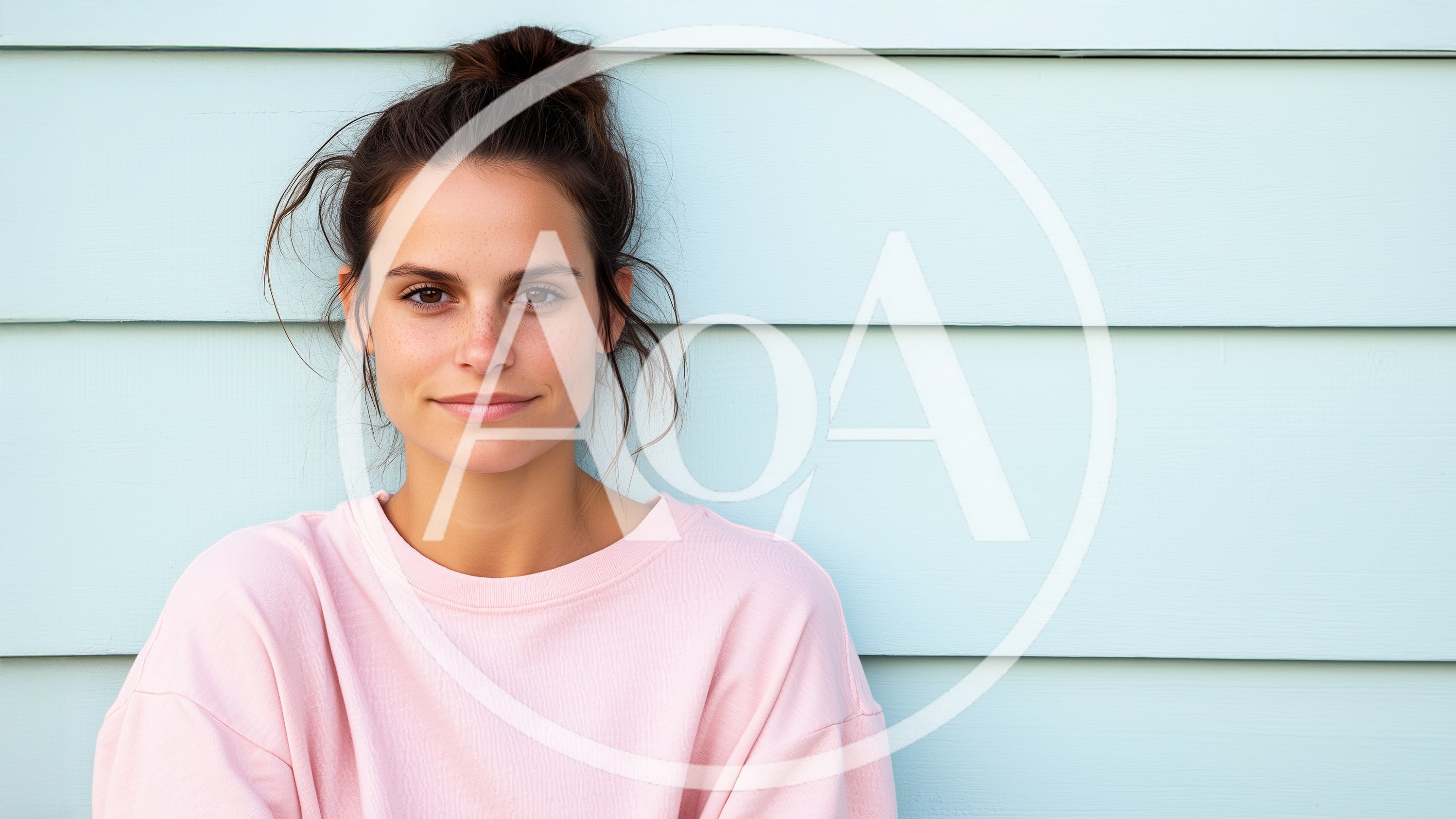 Portrait Of A Young Woman Against A Blue Wall