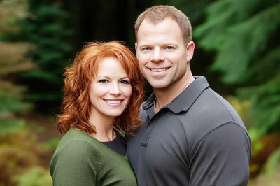 Happy Couple Posing Together In A Lush Forest Setting