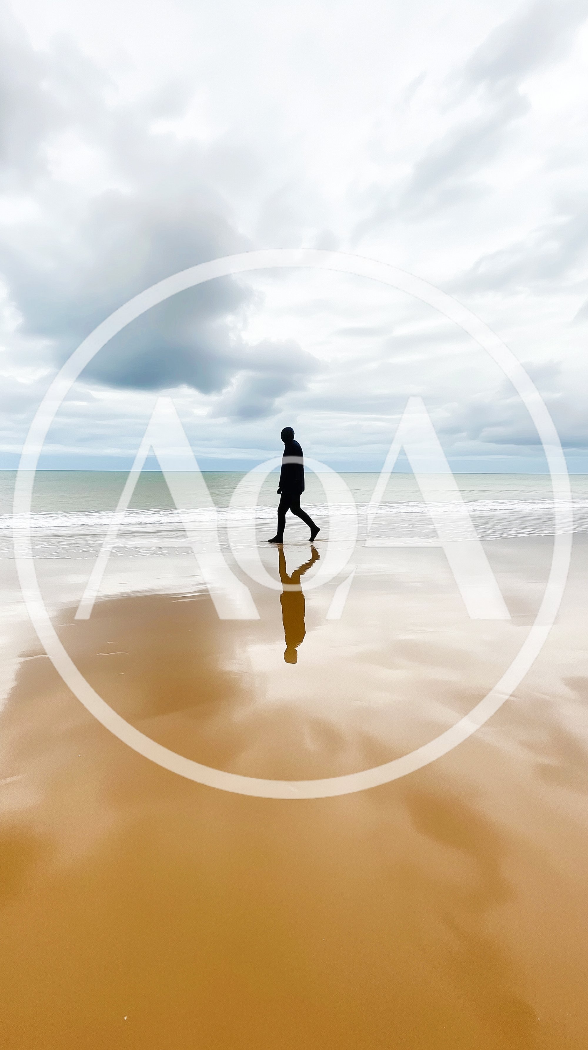 Silhouette Of A Person Walking On A Sandy Beach