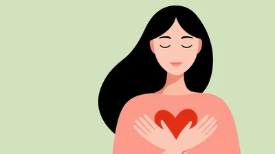 Woman Holding A Red Heart Symbol