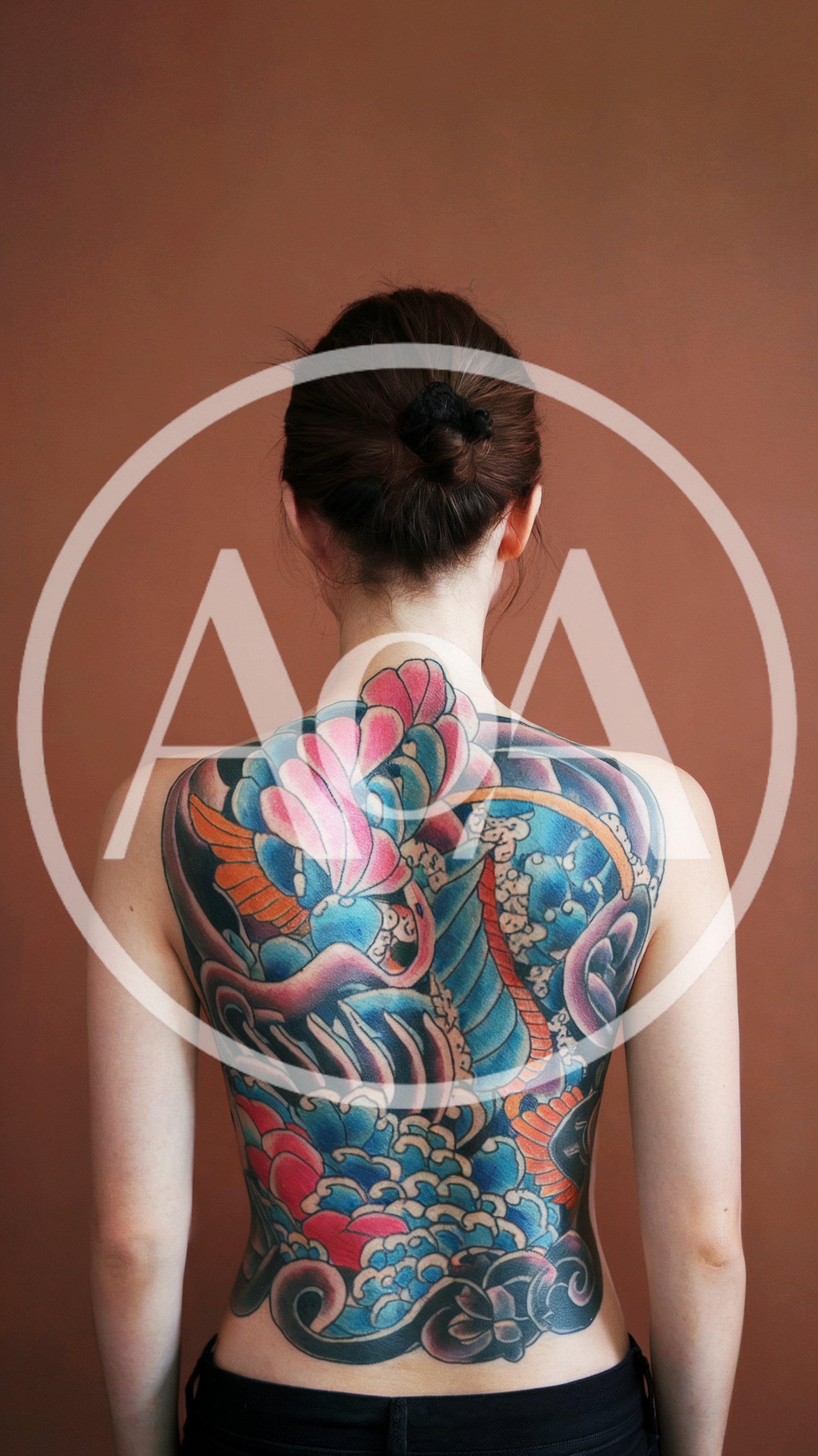 Woman With Large Colorful Japanese Style Back Tattoo