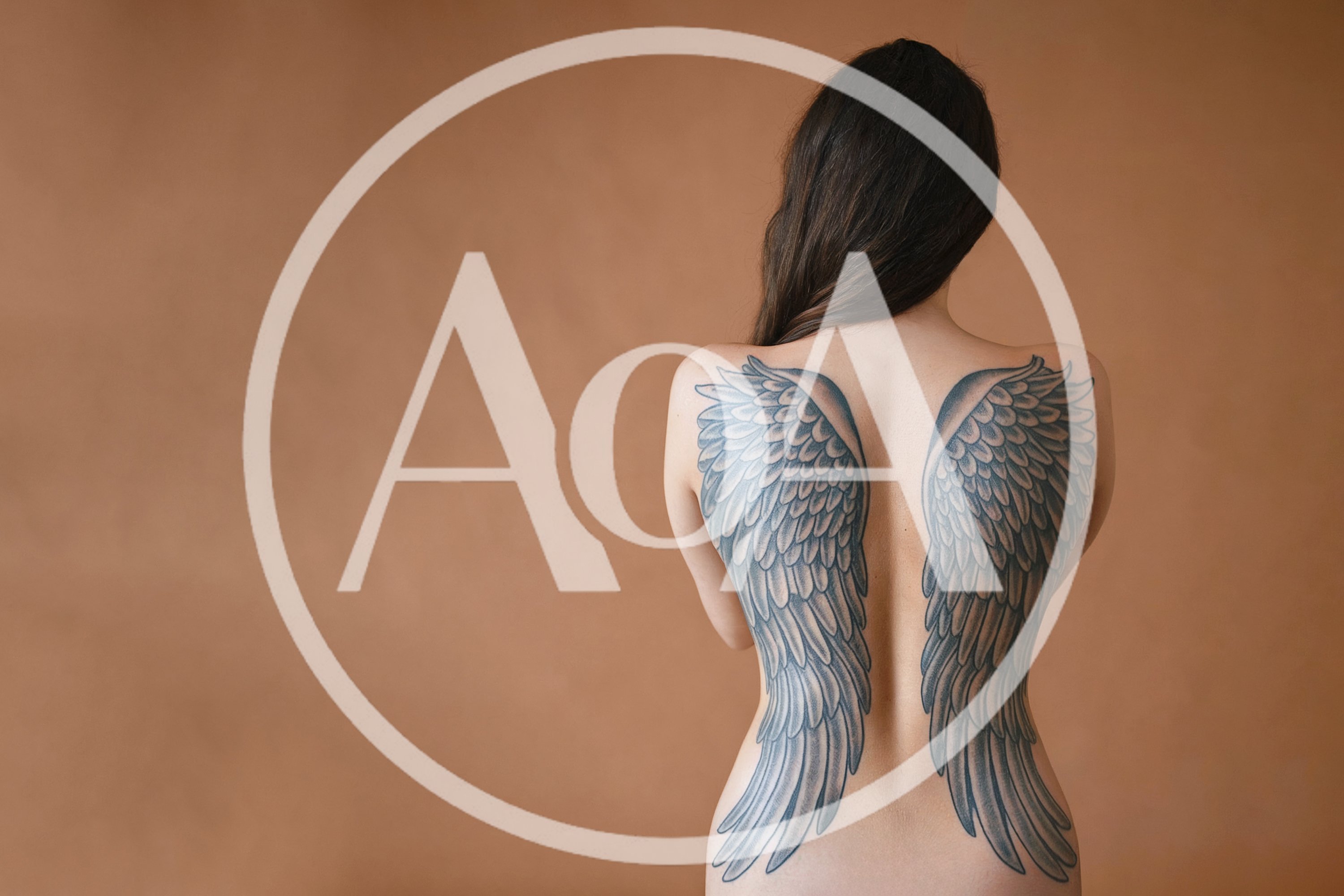 Woman With Angel Wing Tattoos On Her Back