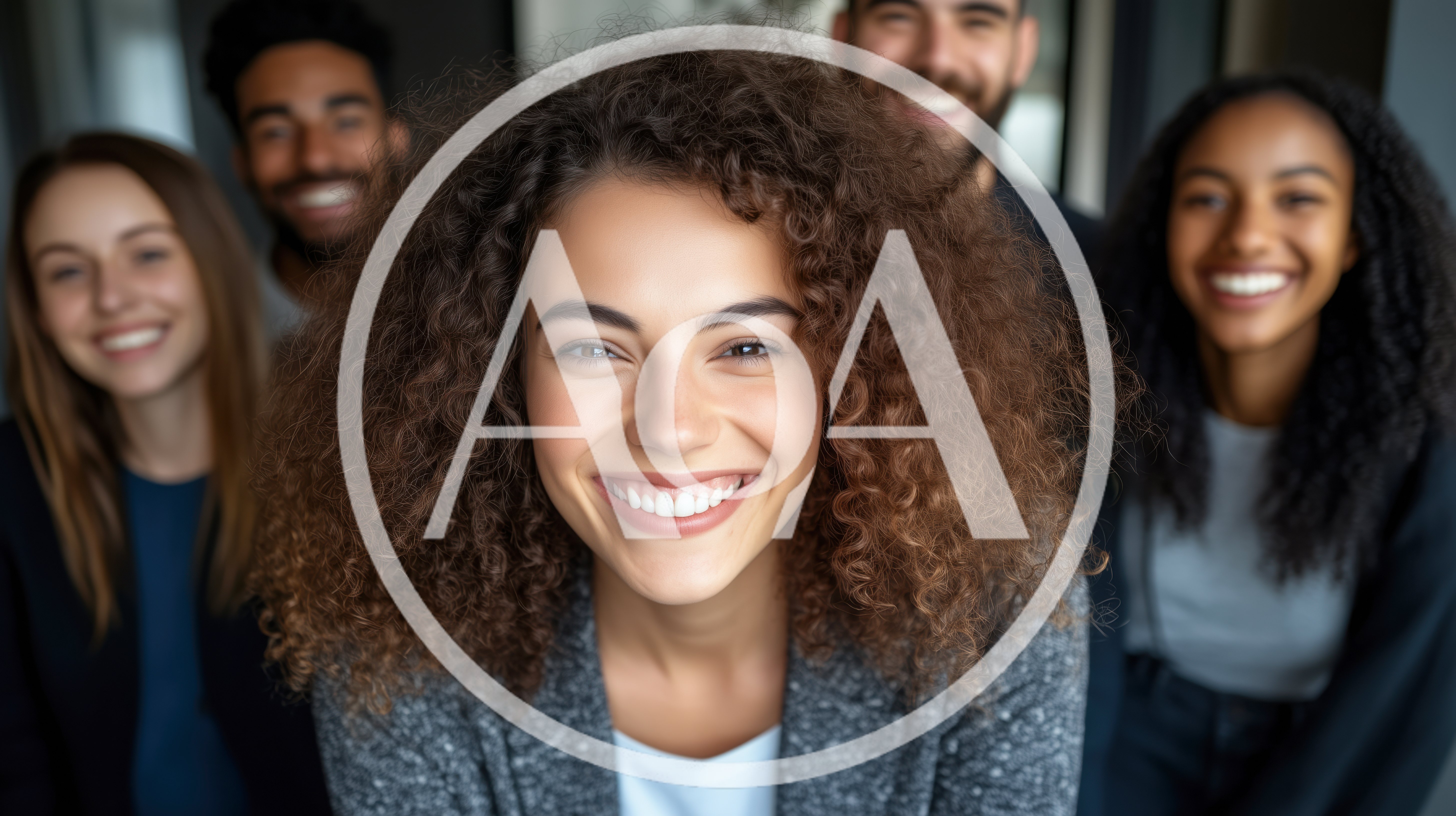 Diverse Group Of Smiling Young Professionals Looking At Camera