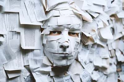 Person Covered In Layers Of Paper Strips