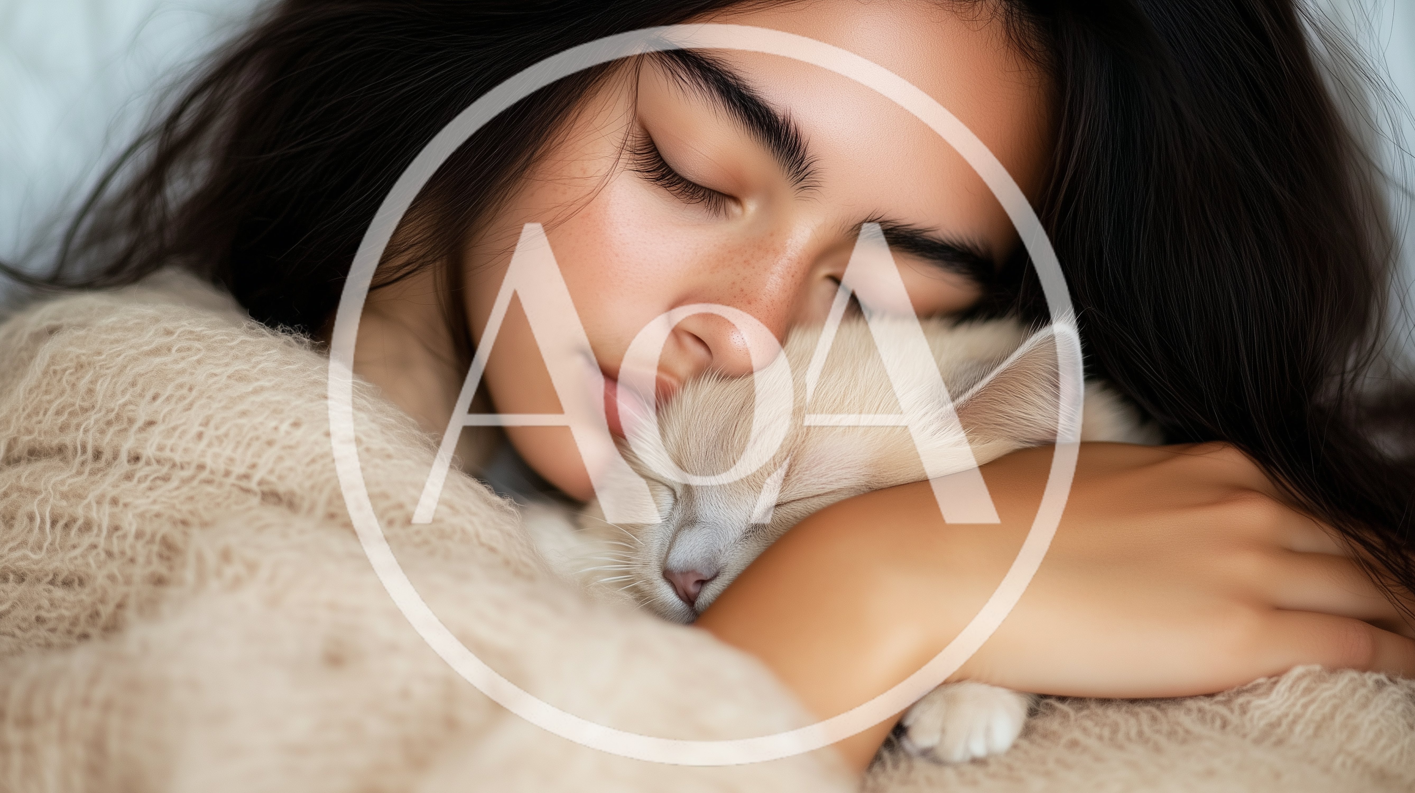Young Woman Cuddling Her Sleeping Kitten