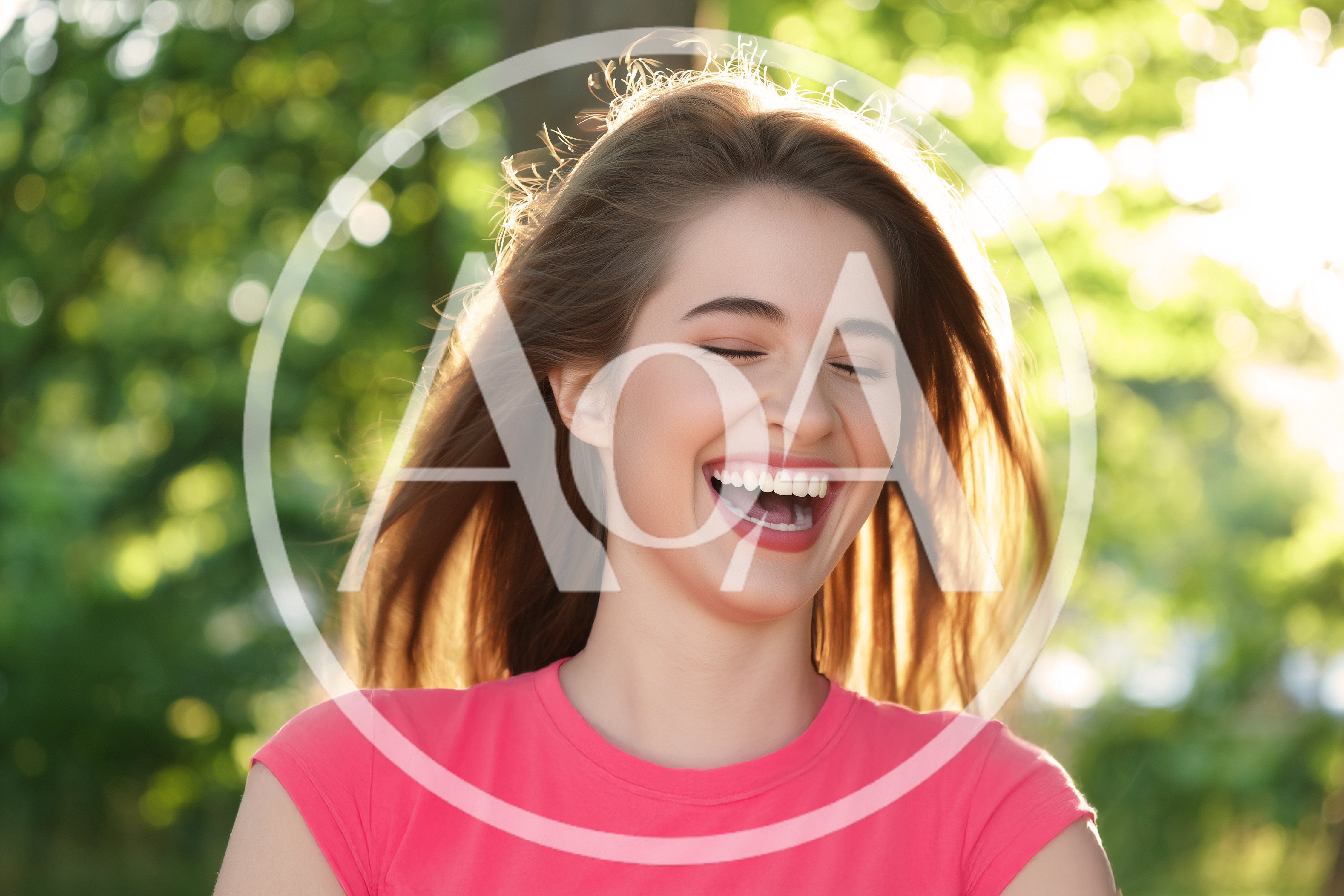 Young Woman Laughing Outdoors In Sunlight