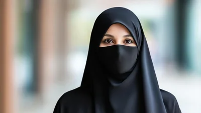 Portrait Of A Woman Wearing A Black Hijab And Mask