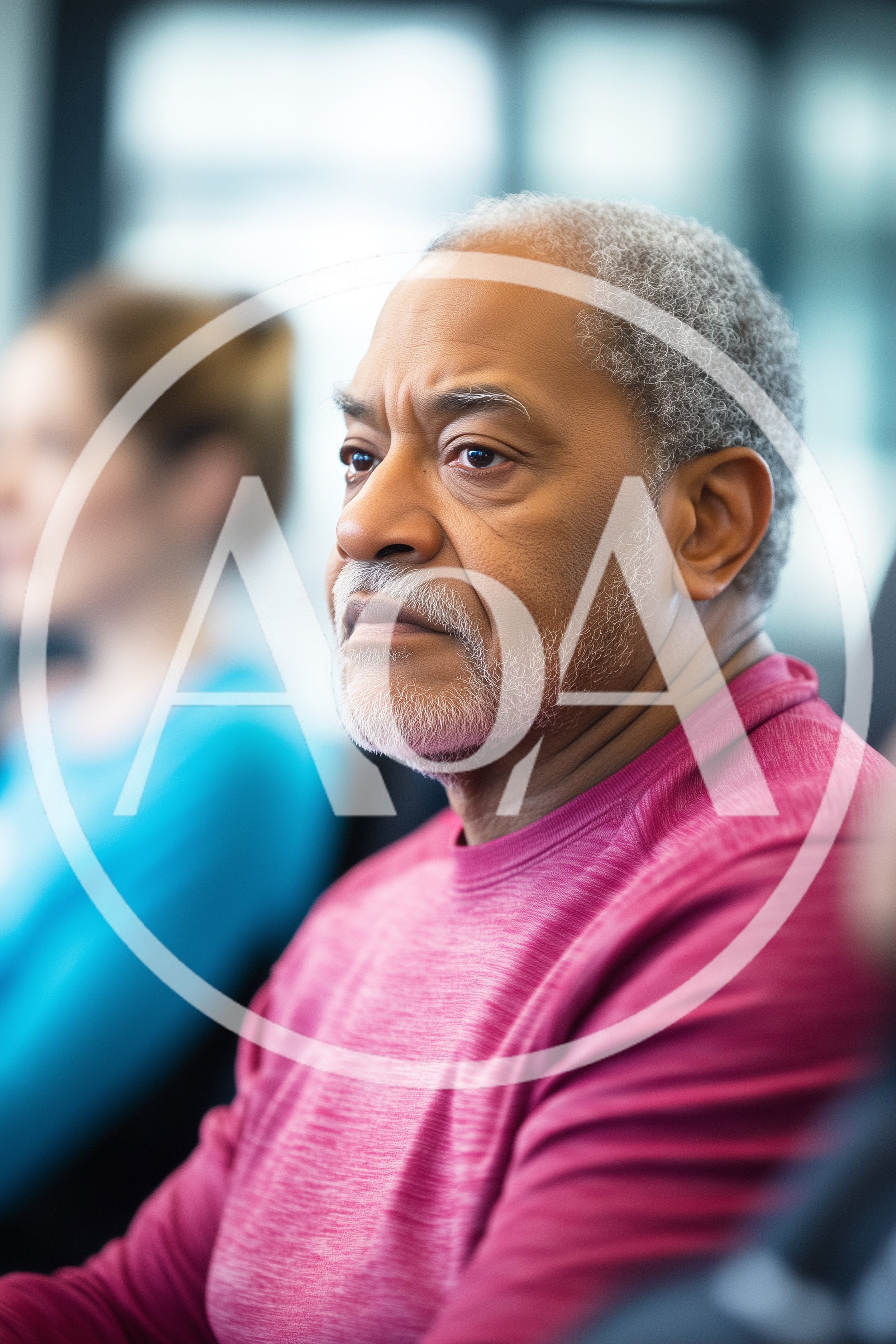 Senior African American Man Listening During Office Meeting