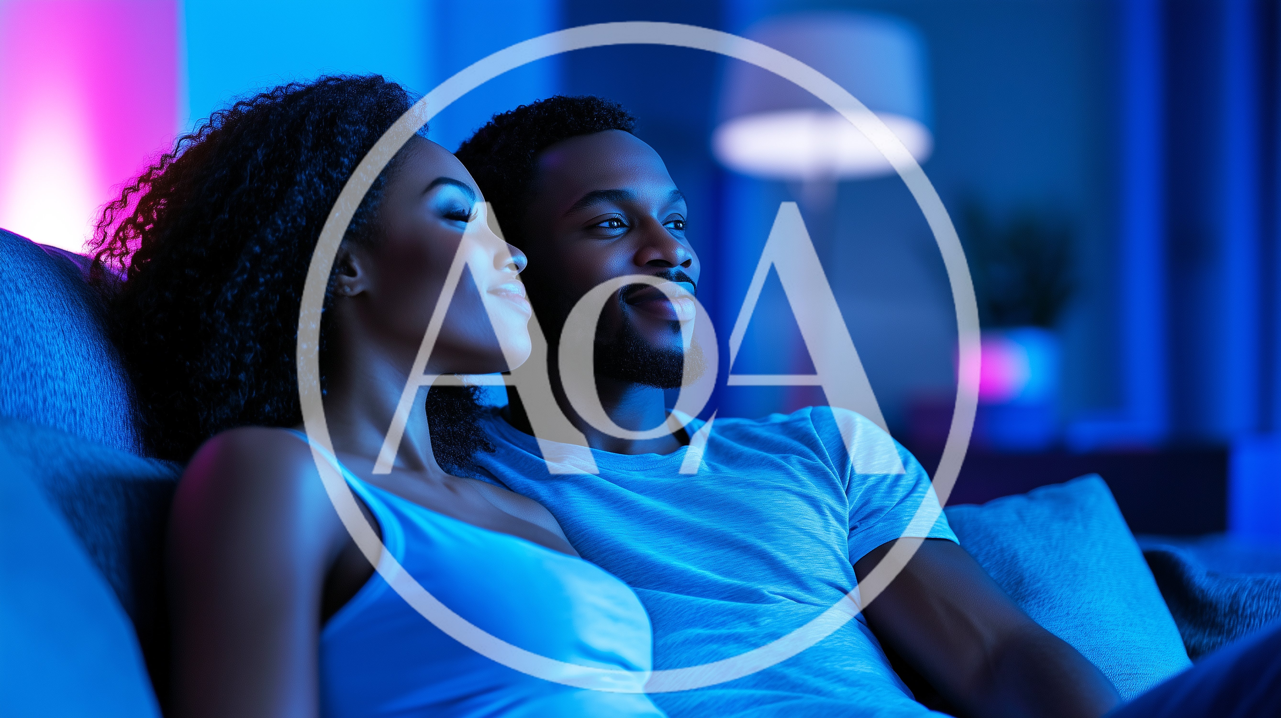Young Couple Relaxing Together On Sofa At Home