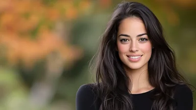 Portrait Of A Smiling Young Woman Outdoors