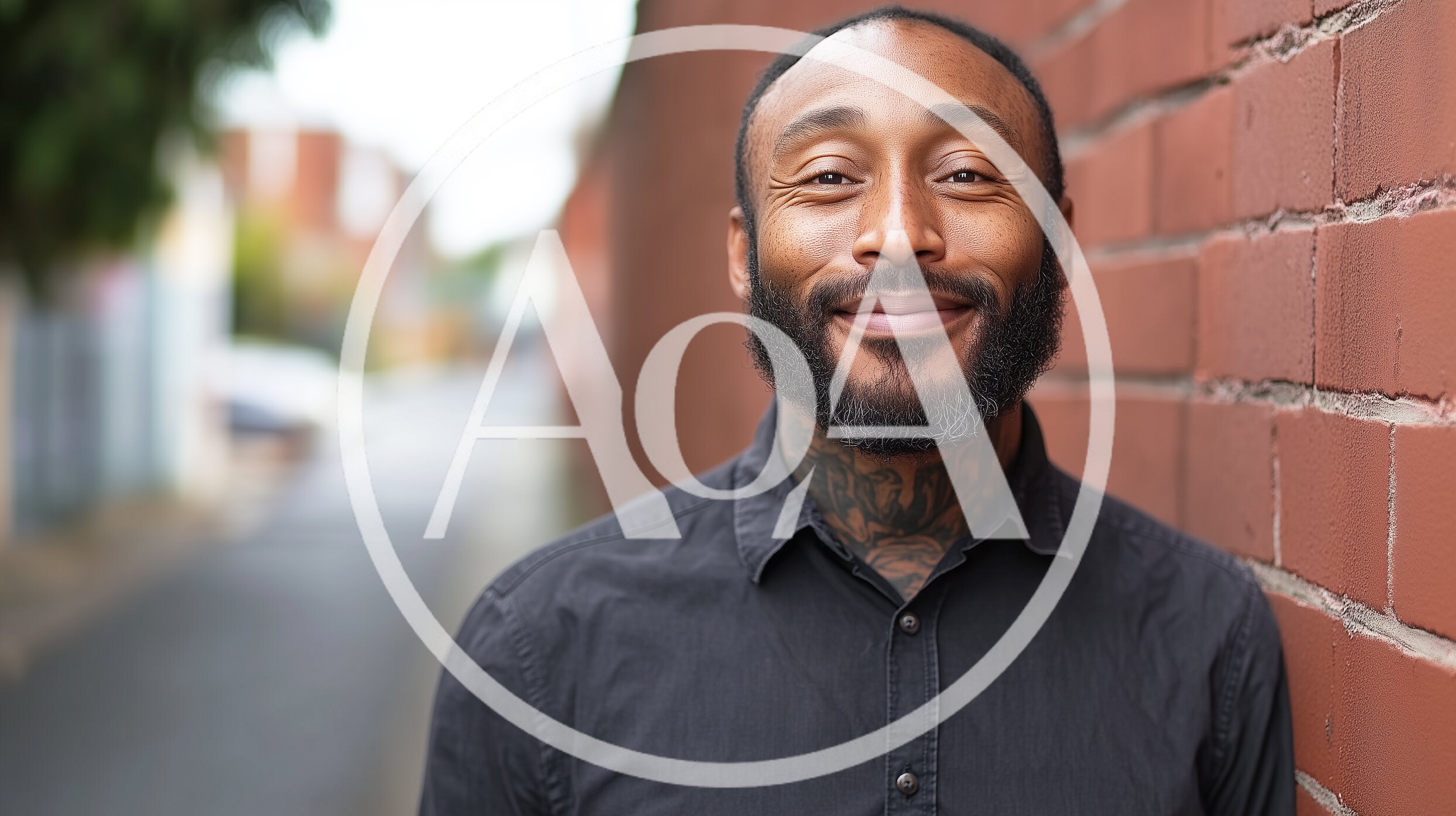 Portrait Of A Smiling Man With Neck Tattoos