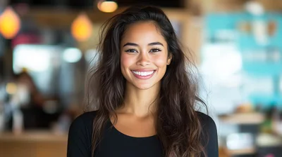 Portrait Of A Smiling Young Woman With Long Hair