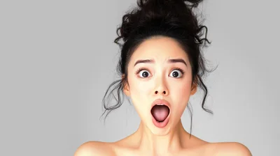 Surprised Young Asian Woman With Wide Open Mouth