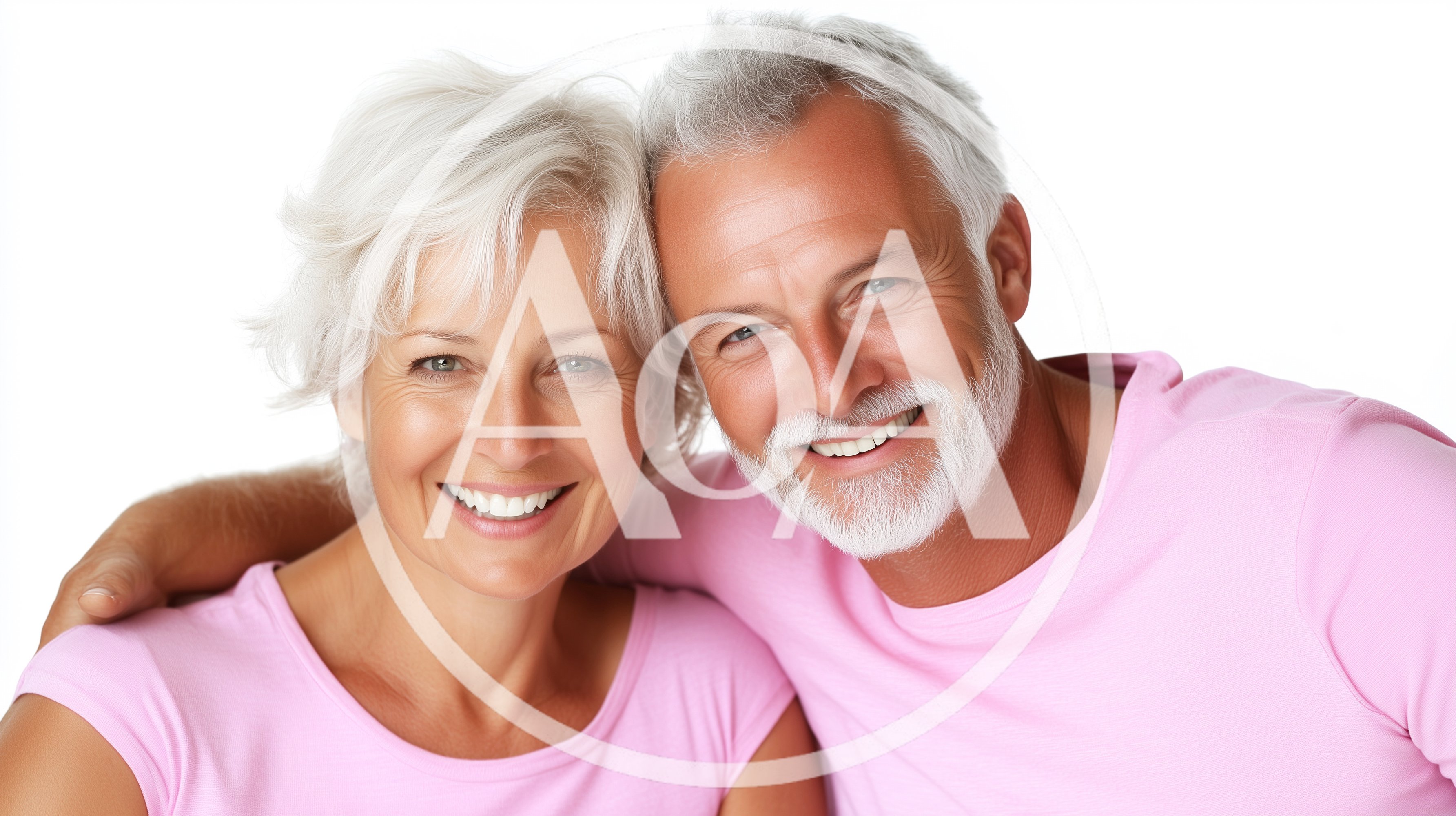 Happy Senior Couple Embracing Against White Background