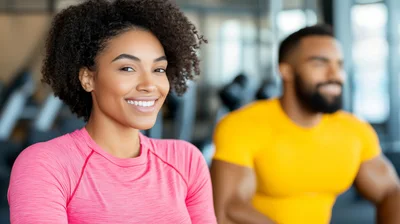 Smiling Woman Exercising With Personal Trainer In Gym
