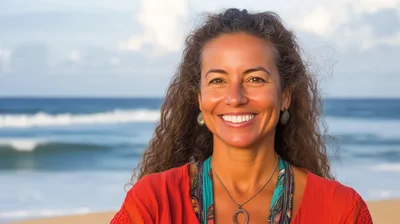 Smiling Mature Woman Standing On A Tropical Beach