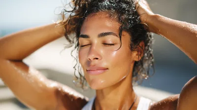 Woman With Wet Curly Hair Refreshing Outdoors